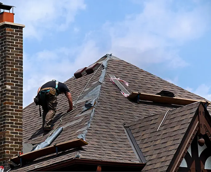 worker working on roof repair in springfield il