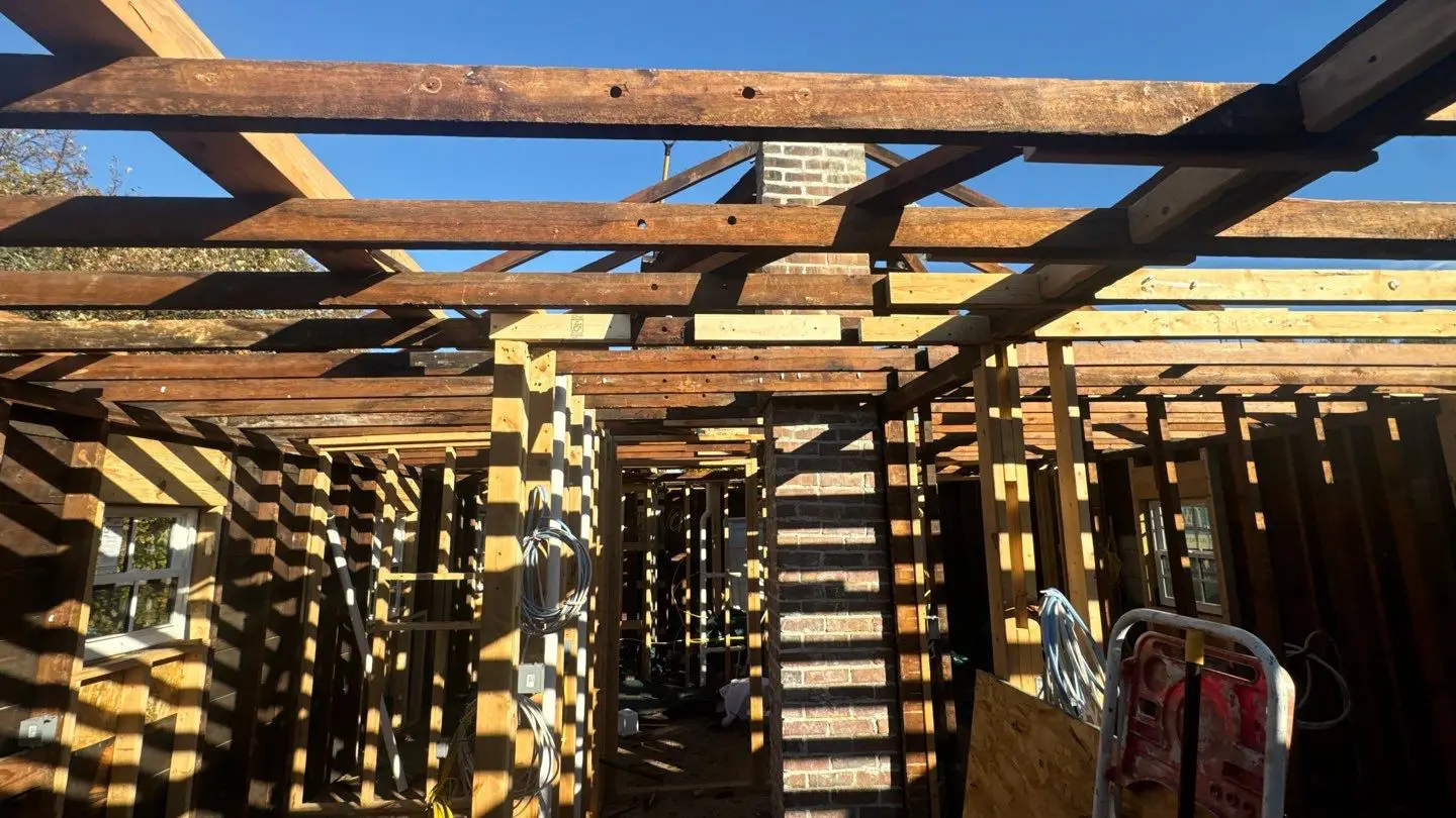 Interior framing exposed during complete roof reconstruction and home renovation in Springfield, IL