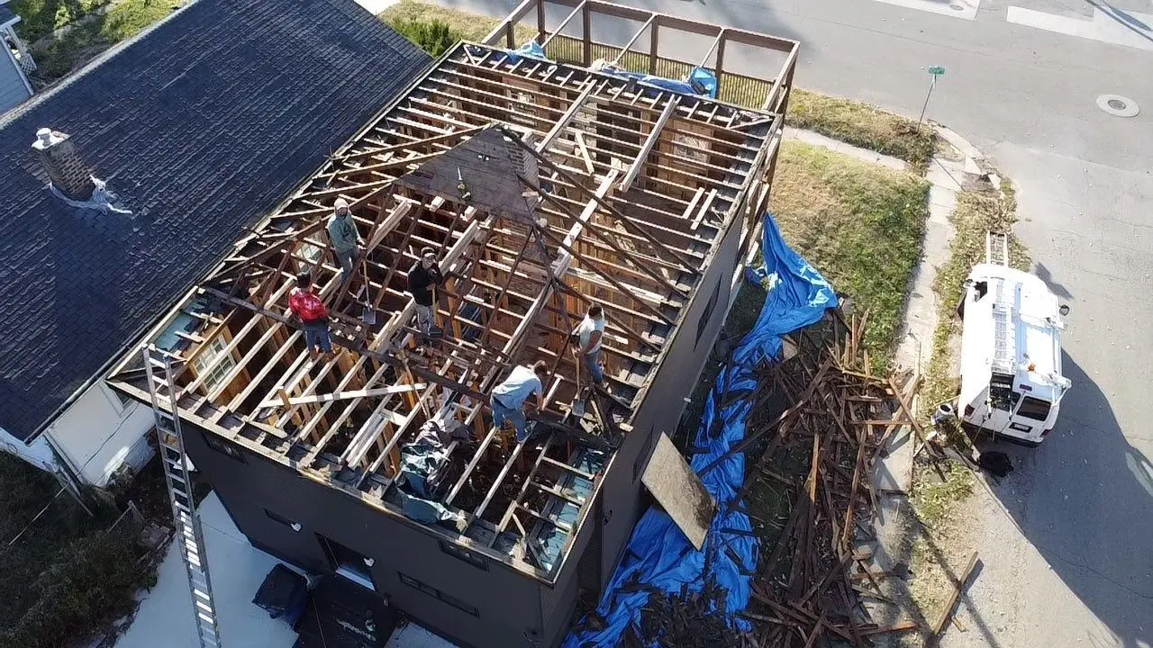 Drone view of structural roof framing exposed during complete roof replacement and remodel in Springfield, IL