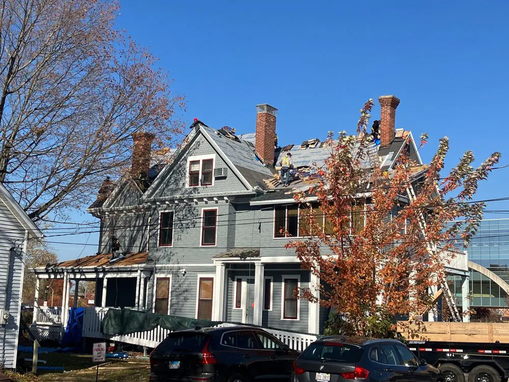 Roofing crew installing new roofing system on historic building in Springfield, IL