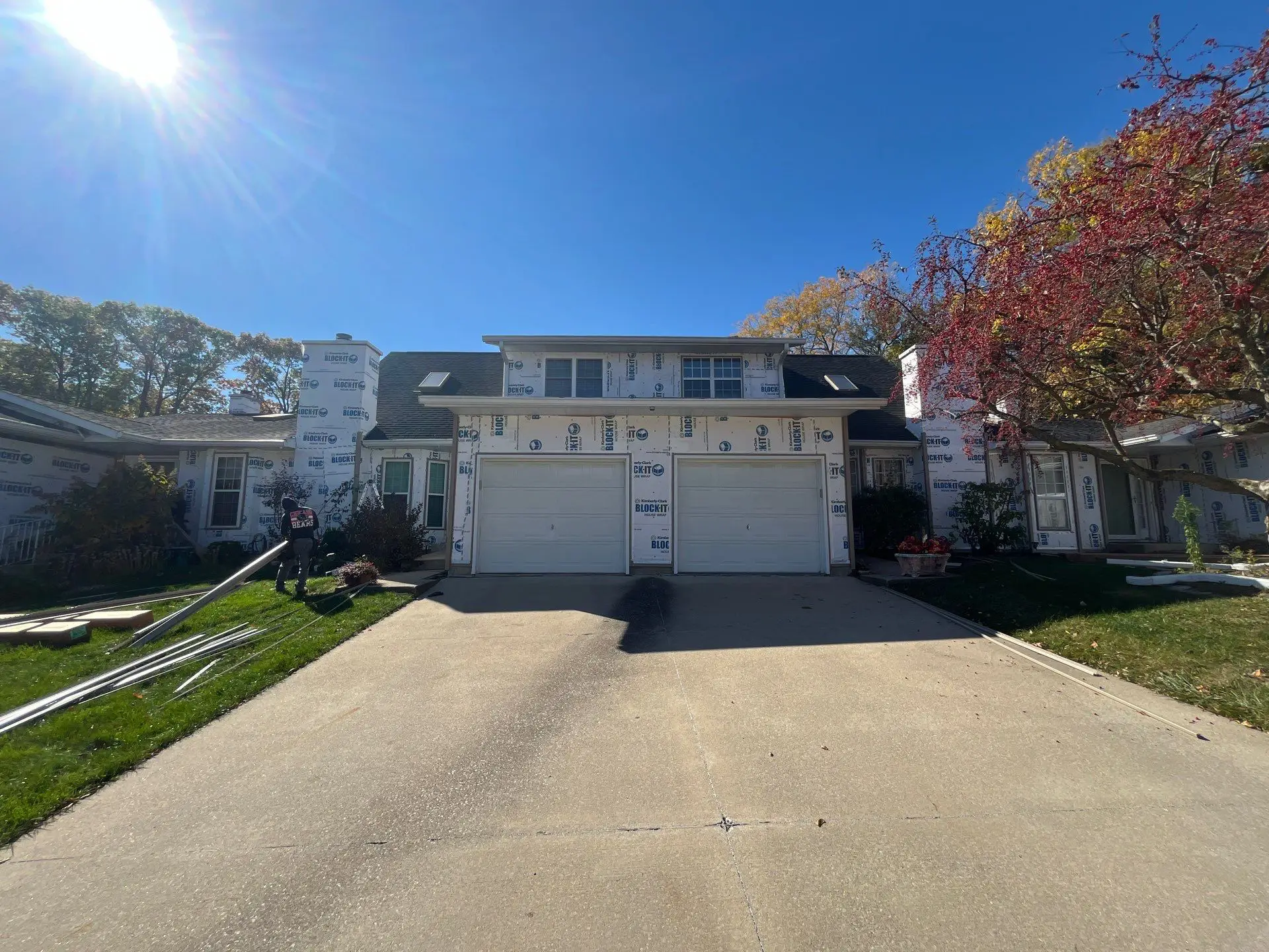 Wide view of townhouse exterior wrapped and ready for new vinyl siding in Springfield, IL