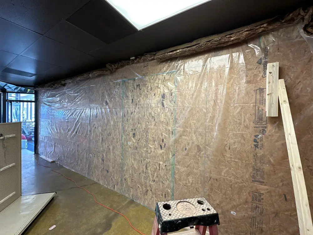 Interior storefront wall prepared for structural commercial renovation in Moline, IL