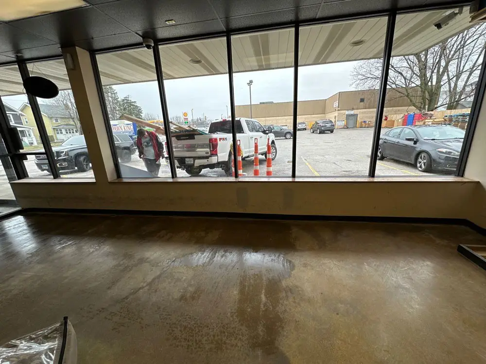 Storefront display window before commercial remodeling project in Moline, IL