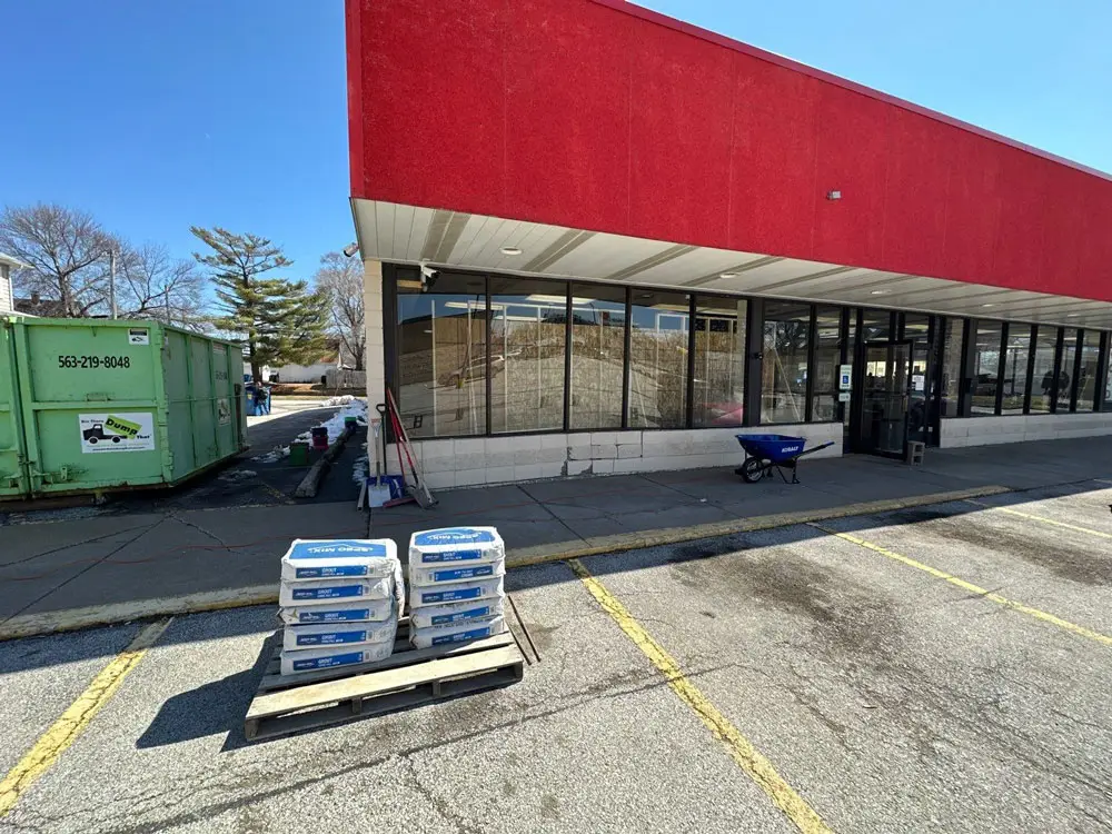 Exterior view of commercial storefront before structural renovation in Moline, IL
