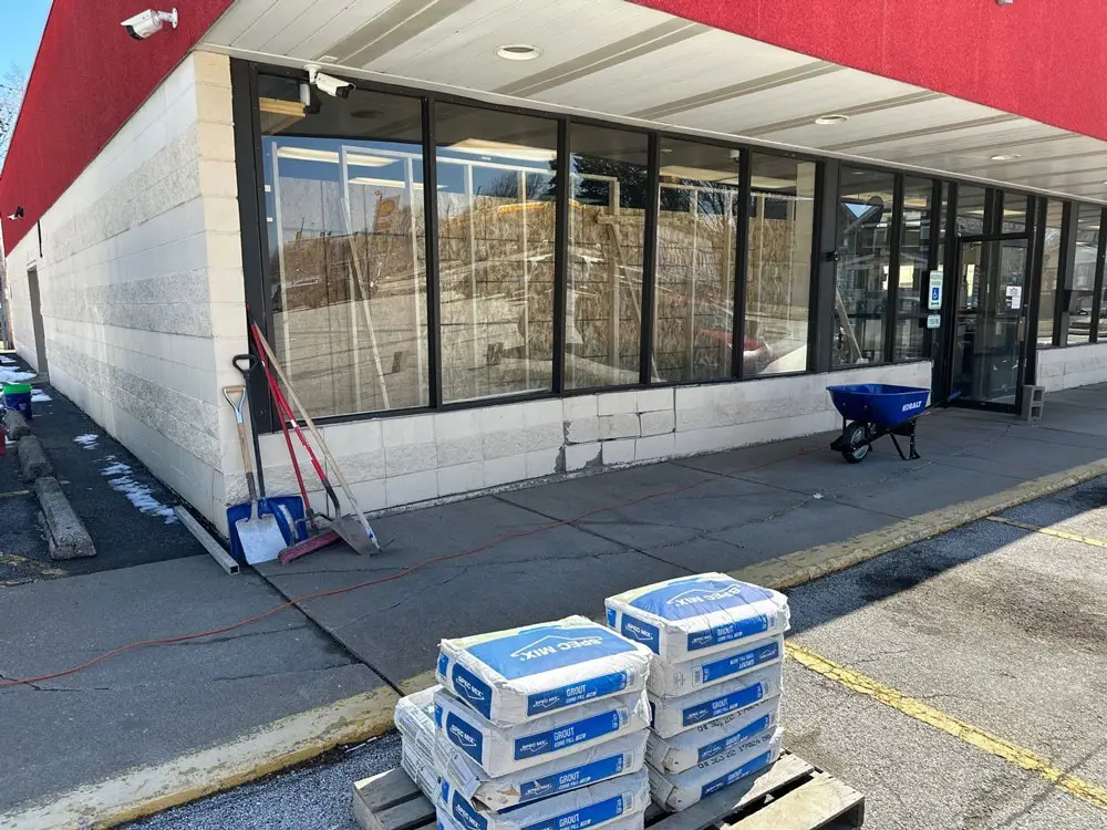 Commercial storefront prepared for exterior structural repairs in Moline, IL
