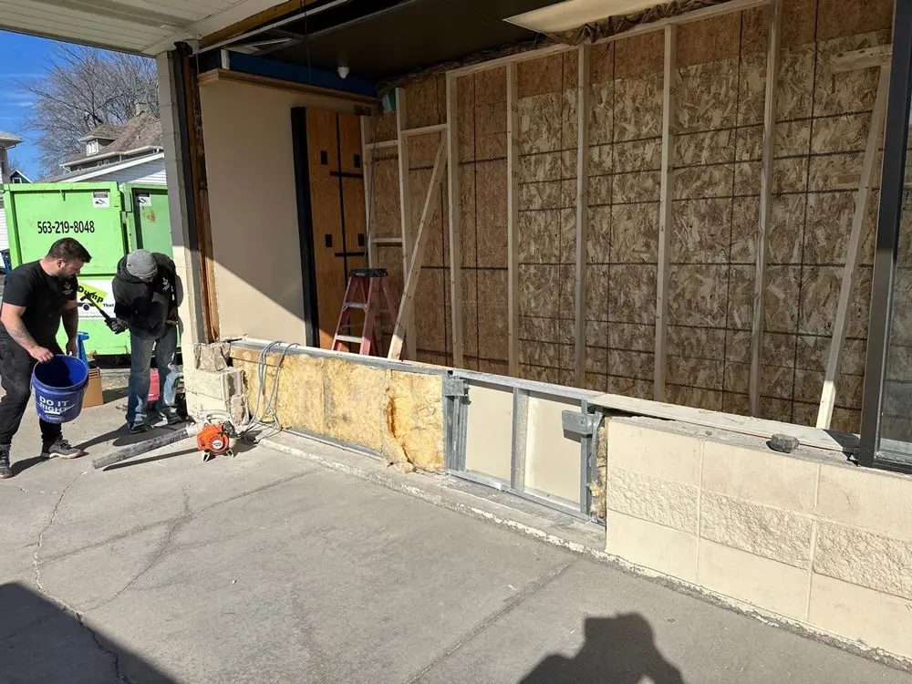 Commercial storefront wall opened for structural repair and remodeling in Moline, IL