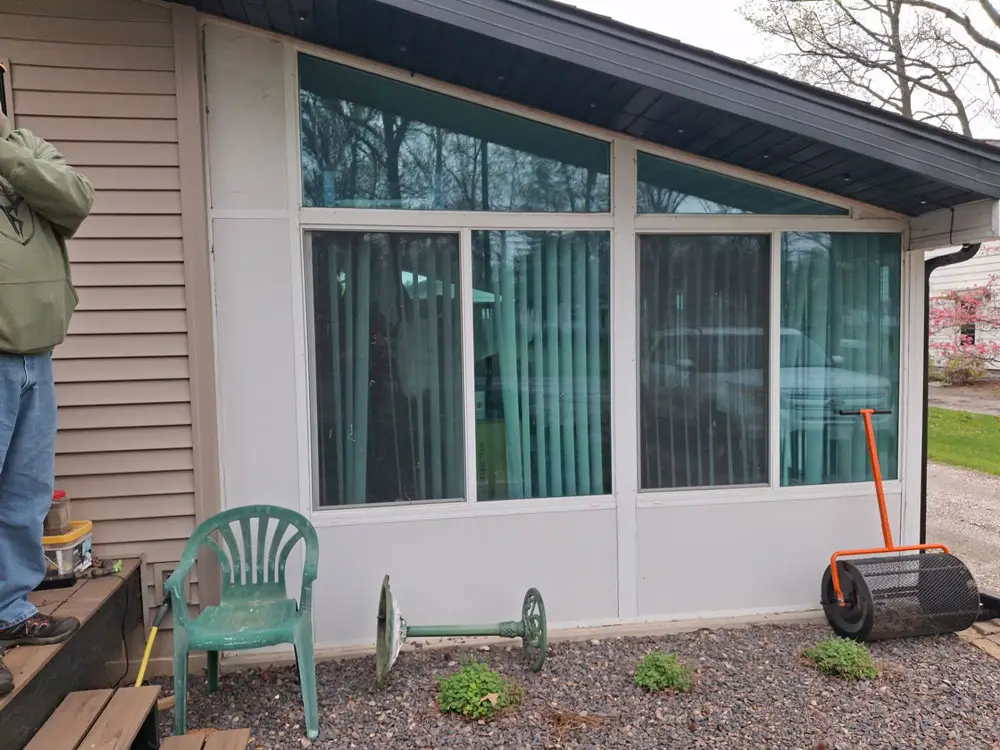 Renovated sunroom exterior with new windows and trim in Springfield, IL