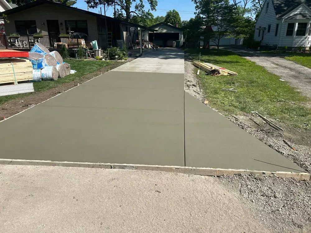 Newly poured residential concrete driveway installation in Springfield, IL